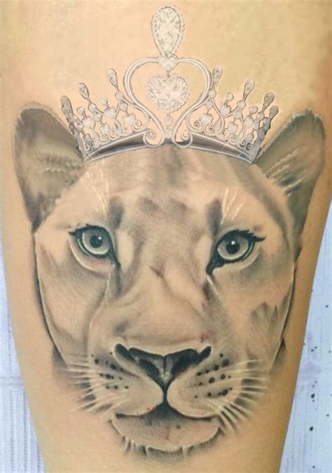 A Lion With A Crown On Its Head Is Shown In This Tattoo Design