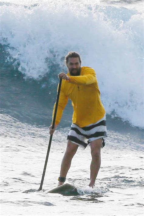 jason momoa goes paddle boarding in hawaii after aquaman opens