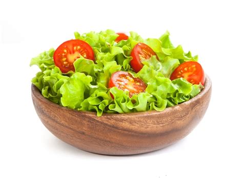 Premium Photo Tomato And Lettuce On Wooden Bowl