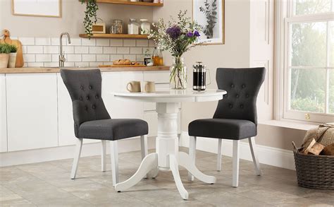 The width of your go big on the table and small on the seating when looking to take up less room in a space, try incorporating a banquette or bench seat instead of chairs on one. Kingston Round White Dining Table with 2 Bewley Slate ...