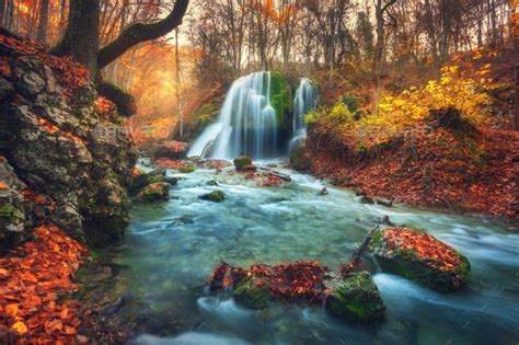 Autumn Forest With Waterfall At Mountain River At Sunset Stock Photo By
