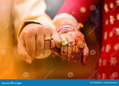 indian wedding images holding hands