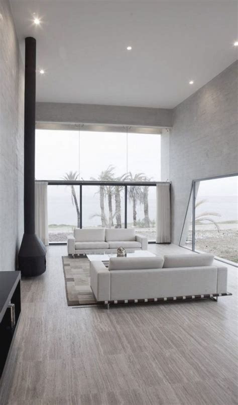 Living room is the most important area in a house since it is always in view and it is where we used to host guests, thus it has to be comfy and elegant. 30 Adorable Minimalist Living Room Designs - DigsDigs