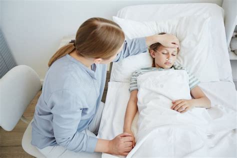 Mother Caring For Sick Child In Hospital Stock Image Image Of Resting