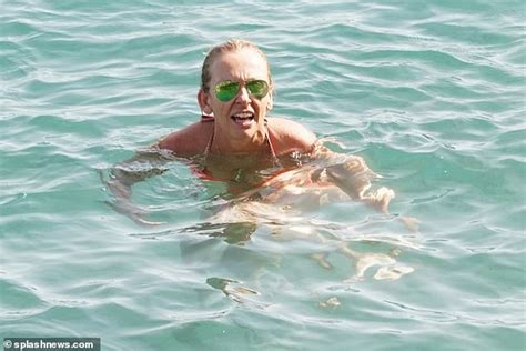 toni collette looks sensational in orange bikini as she cools off in italy while temperatures