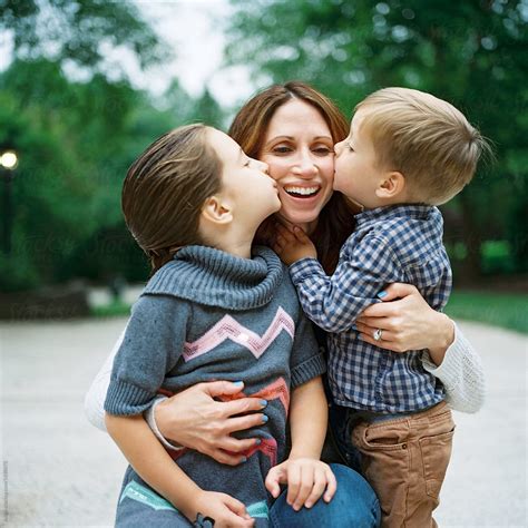 Young Daughter And Son Kissing Their Mother On The Cheek By Jakob