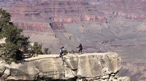 Heart Stopping Moment Woman Almost Falls Down Grand Canyon While Backing Up To Take Photo