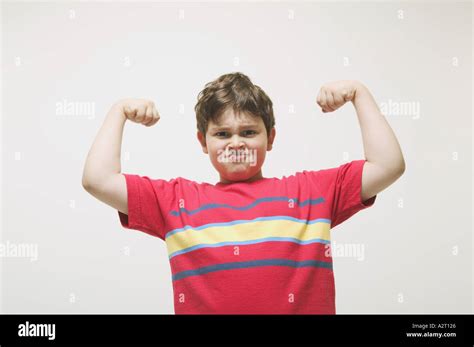 Kid Flexing Muscle Hi Res Stock Photography And Images Alamy