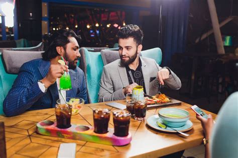 Two Man In Bar Hold Glasses Sit At Counter Drinking Cocktail Cheerful Friends Meeting Bar