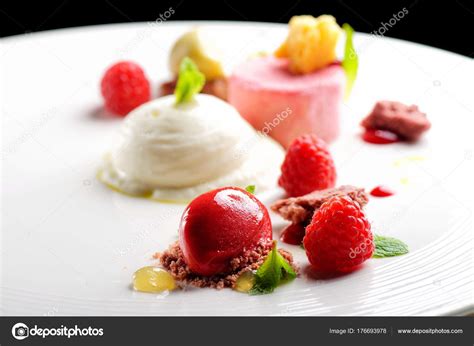 Photo about fine dining desserts in the form of cream custard tarts. Fine dining dessert, Raspberry Parfait — Stock Photo © vision.si #176693978