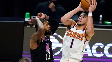 george scores 33 points clippers snap suns winning streak