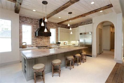 With expert kitchen designers on hand at each and every one of our stores, we are ready to make your dream kitchen a reality. pale gray kitchen cabinets; exposed brick backsplash ...