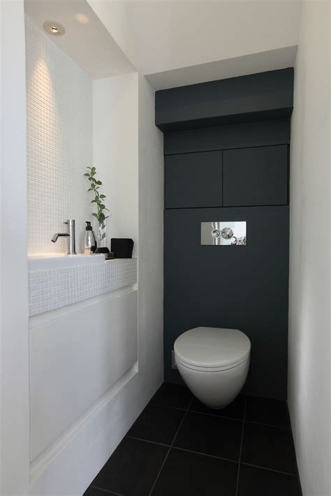 Love The Dark Back Wall And Break In The Side Wall Small Toilet Room