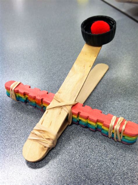 I actually used some mini popsicle sticks for my instruction photos and then made a catapult with full size popsicle awesome! DIY catapult out of Popsicle sticks and rubber bands ...