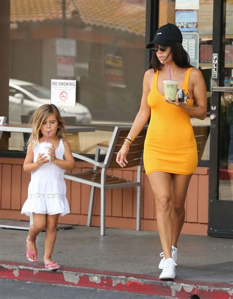 Kourtney Kardashian In Yellow Mini Dress 01 Gotceleb