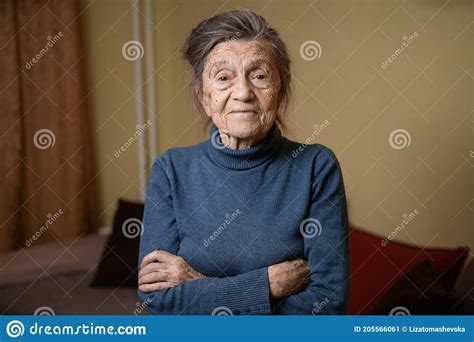 Elderly Caucasian Senior Grandmother Ninety Years Old Looks Attentively And Smiles Feels Happy