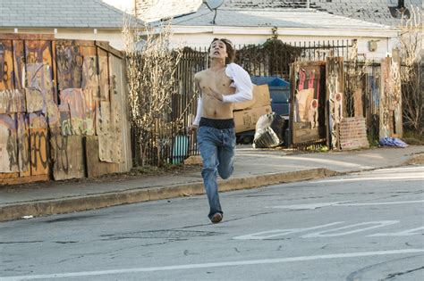 nick frank dillane runs from a church full of zombies in fear the walking dead © 2015 justin