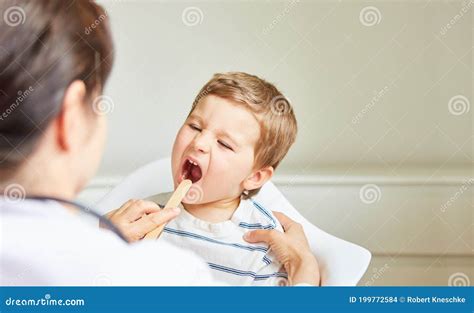 Pediatrician Examines Child With Tonsillitis Stock Photo Image Of