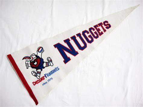 The best new sports logos of 2018 (dec 20/18) • nuggets bring back the rainbow with new uniform (nov 1. Denver Nuggets Pennant Vintage White Felt Circa 1974 Old Miner Stitched Logo 33" #DenverNuggets ...