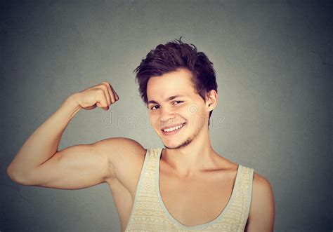Fit And Muscular Young Man Flexing His Biceps Stock Image Image Of