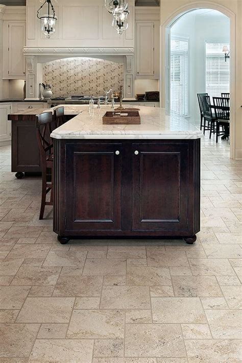 Kitchen tile flooring can be tricky to install for even seasoned diyers as the process requires a special saw for cutting pieces to fit around cabinets or corners. Travertine Floor Tile in a Luxury Kitchen - Remodeling Cost Calculator