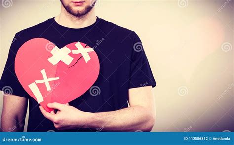 Sad Man With Glued Heart By Plaster Stock Photo