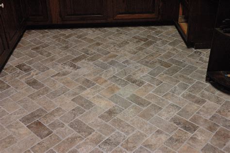 Antique limestone is another popular option, with grey, black and jaipur versions available from stone tile. Custom Bathroom Remodeling: Natural Stone Herringbone Tile Floor