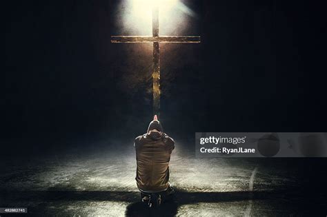 Man Kneeling Before The Cross High Res Stock Photo Getty Images