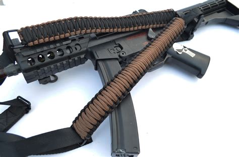 A type of gun with a long barrel (= part shaped like a tube), fired from the shoulder and…. DARK EARTH - Single Point Tactical Paracord Rifle Gun ...