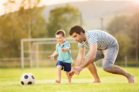 Father And Son Play Football Stock Photo Free Download