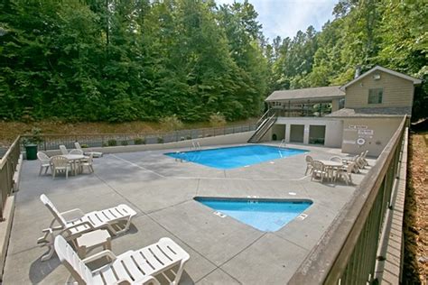 There are many cabins for rent in pigeon forge with indoor pools with many featuring waterfalls, hot tubs, and even a lazy river as shown in this pic of. Pigeon Forge Brookstone Village Cabin With Pool Access