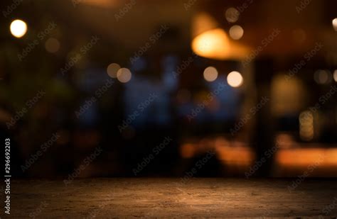 Empty Wood Table Top On Blur Light Gold Bokeh Of Cafe Restaurant In