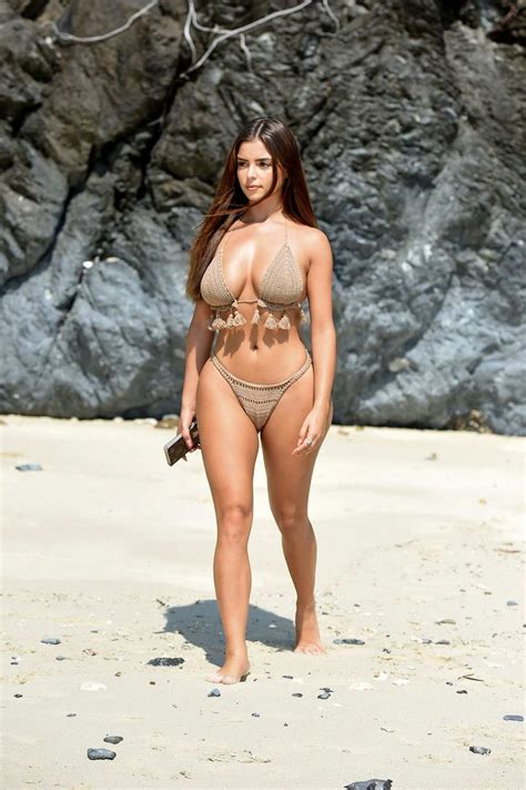 Demi Rose Spotted In A Beige Knitted Bikini During A Beach Photoshoot