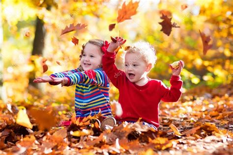 Kids Playing In Autumn Park — Stock Photo © Famveldman 119873730