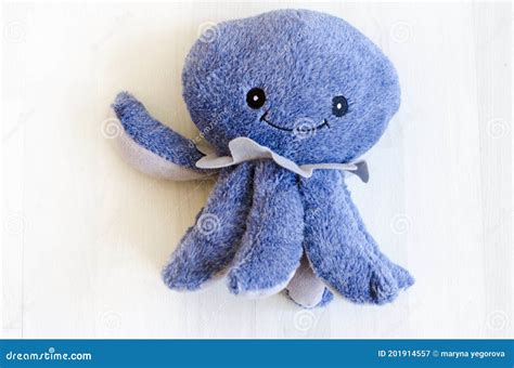 Blue Soft Toy Smiling Octopus On A Light Background Stock Image Image