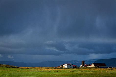 Storm Clouds Over Farmland Iceland Photograph By Stuart Litoff Fine