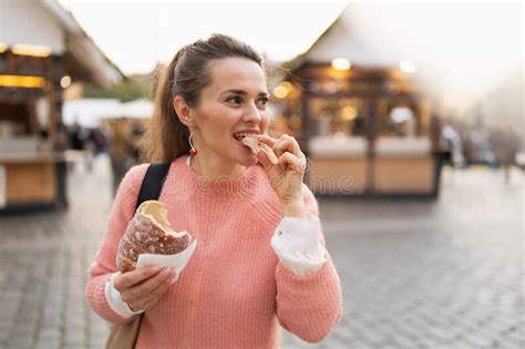 Modern Female At Fair In City Eating Trdelnik Stock Image Image Of
