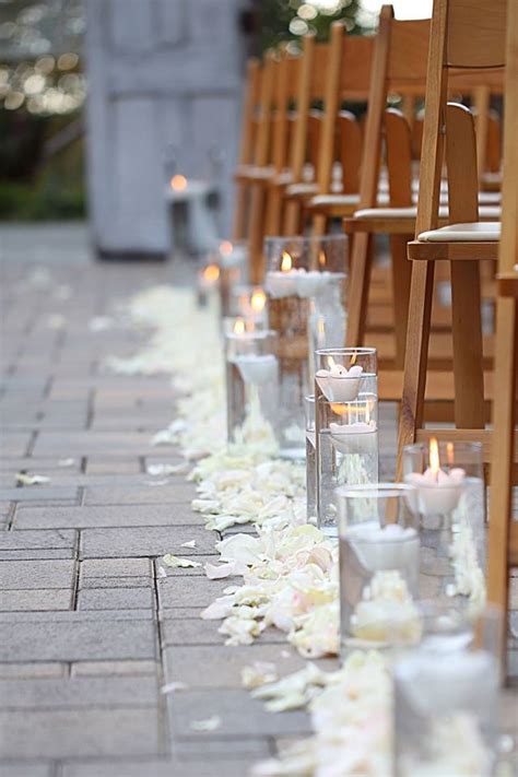Line The Aisle With White Rose Petals And Staggered Clear Cylinder