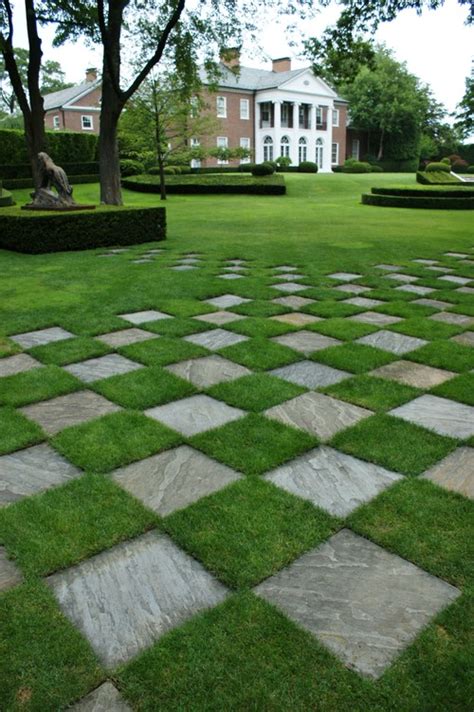 A concrete paver walkway with mexican pebble joints leads from the main house to the backyard art studio. How would you cut the grass that is in between the pavers?