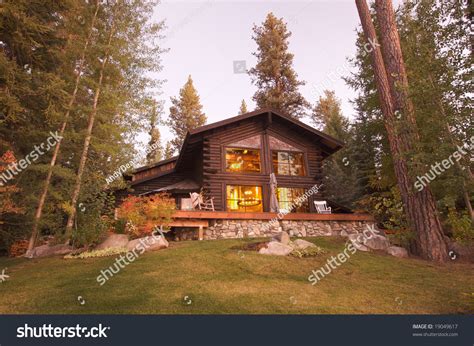 Compare reviews, photos, & availability w/ travelocity. Beautiful Log Cabin Exterior Among Pine Trees Stock Photo ...
