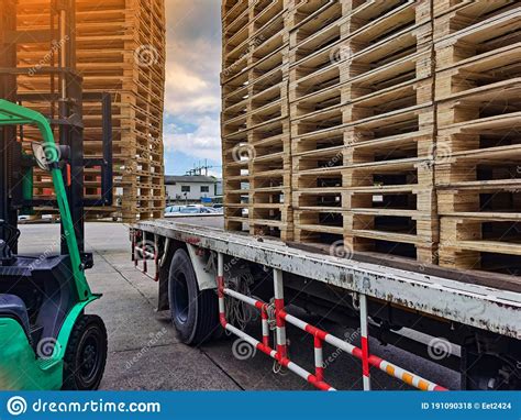 Worker Driving Forklift To Loading And Unloading Wooden Pallets From