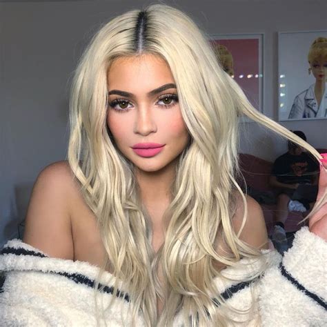 kylie jenner models two different make up looks with long blonde hair before showing off her