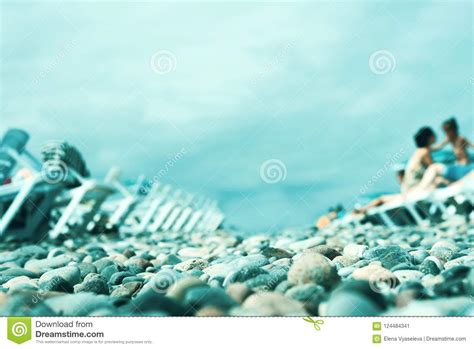 Blurred Background Of The Beach On The Black Sea Coast With Plastic Sunbeds Blue Sky On A Sunny