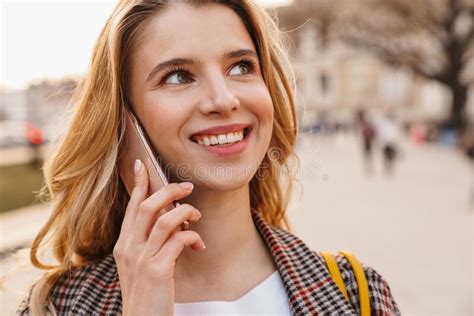 Smiling Young Blonde Woman Talking On Mobile Phone Stock Photo Image