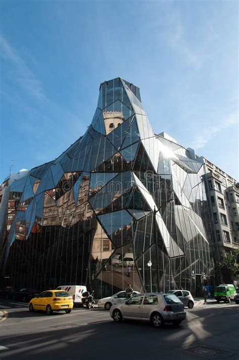 Beautiful Shot Of A Glass Building With An Abstract Architecture On A