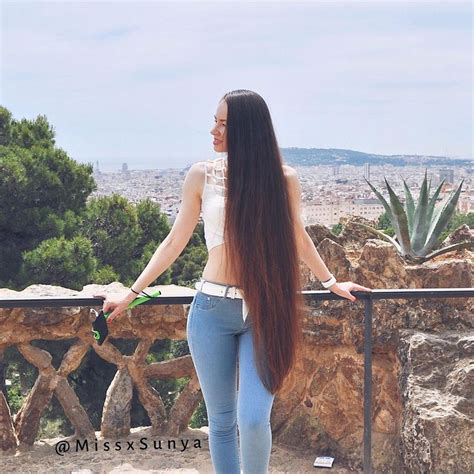 image may contain 1 person standing sky plant outdoor and nature long hair styles