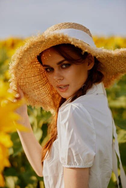 Premium Photo Beautiful Sweet Girl In A Hat On A Field Of Sunflowers