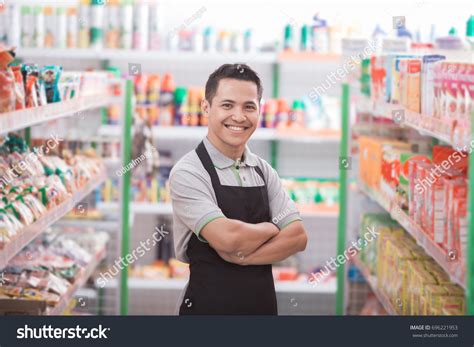 Asian Male Shopkeeper Standing Front Groceries Stock Photo 696221953
