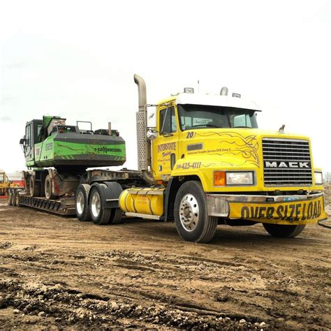 Heavy Equipment Transport Interstate Towing And Transport Specialist Inc