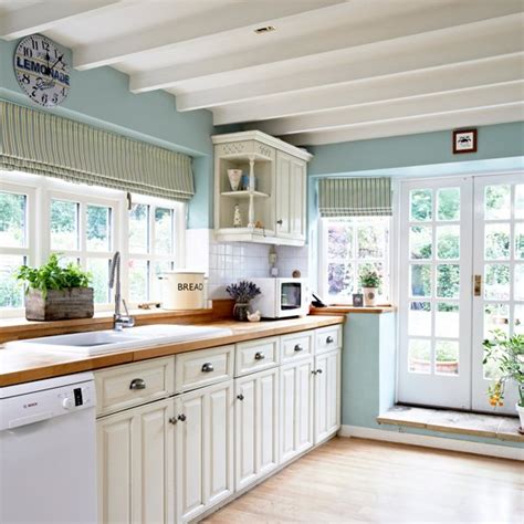 In a modern home, choose a a combination of antiques, vintage accessories and salvaged pieces give this kitchen a sense of grandeur. Ice blue country kitchen with cream cabinetry ...